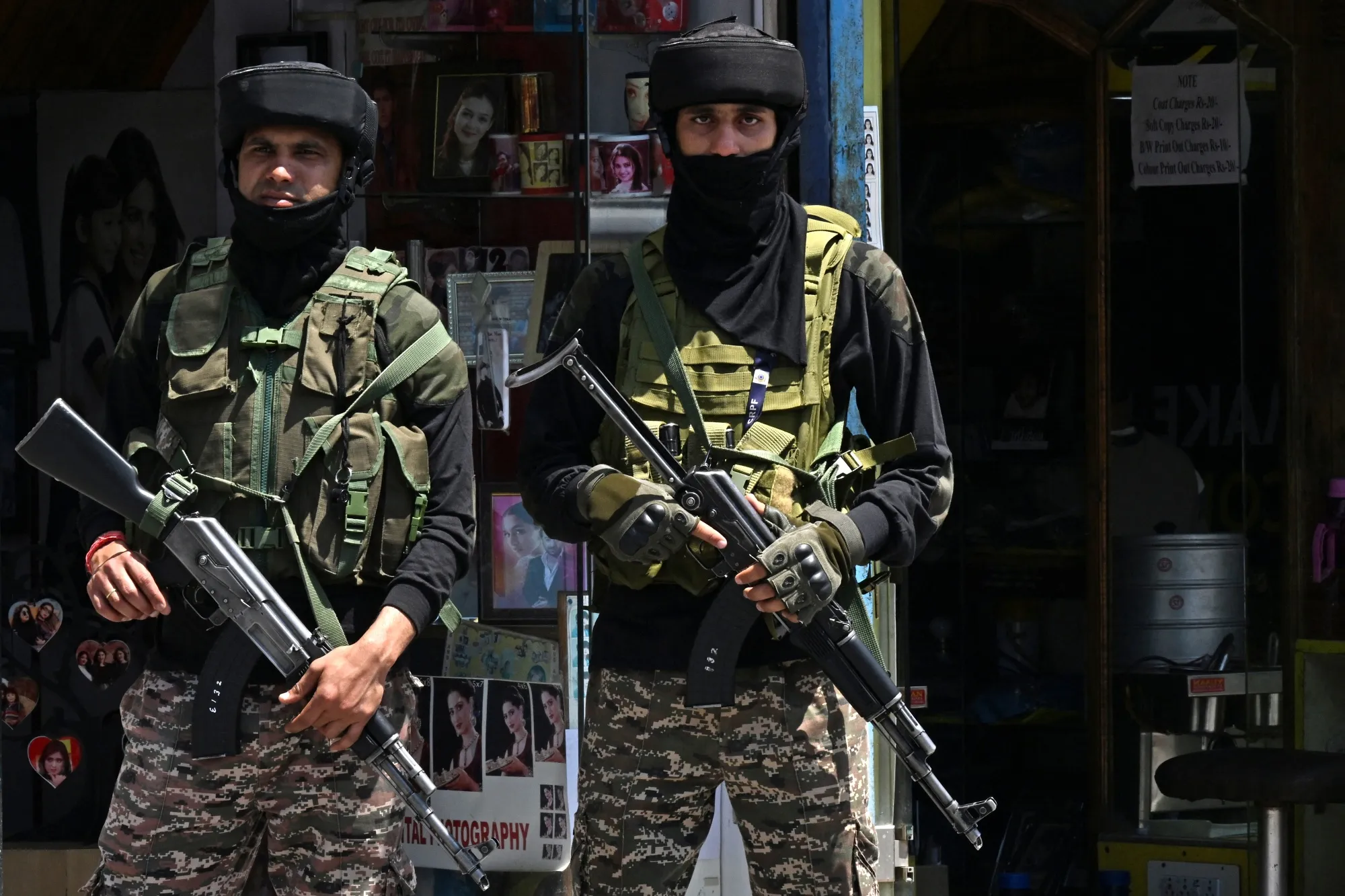 Indian security personnel stand guard along a street in Srinagar on May 15.