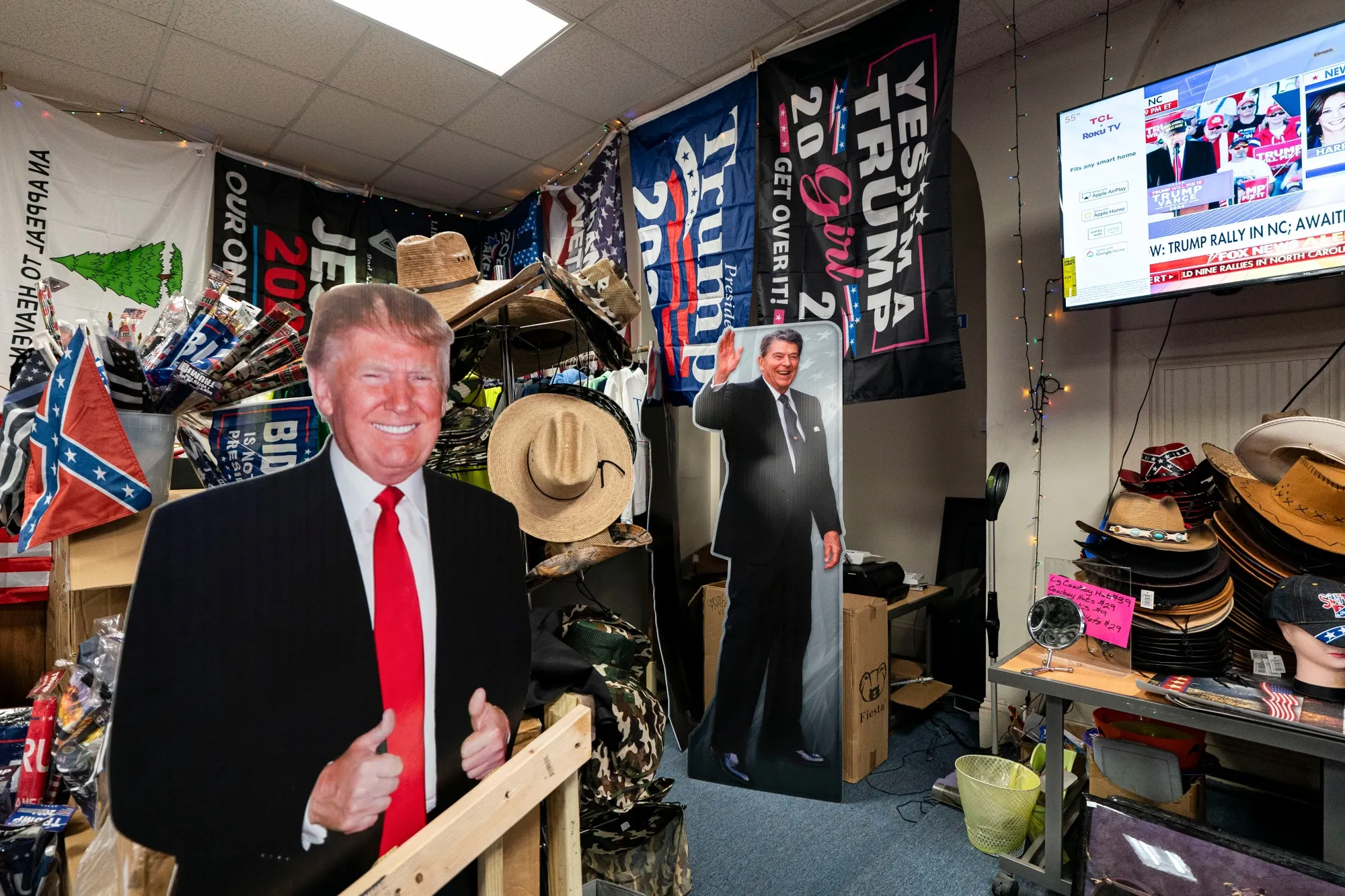 Cardboard cutouts of former US President Donald Trump and former US President Ronald Reagan for sale at the Trump Town USA merchandise store in Boons Mill, Virginia.