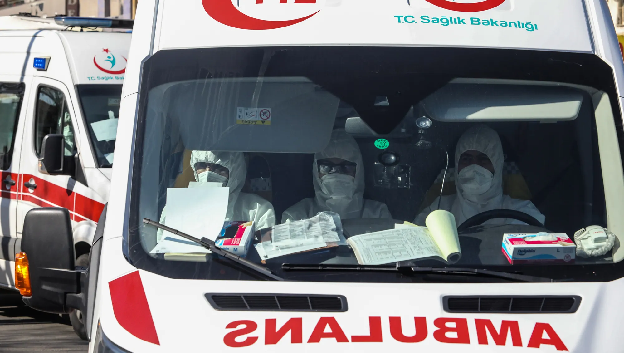 Health personnel&nbsp;ride in an ambulance carrying passengers and crew from a Turkish Airlines plane from Tehran&nbsp;in Ankara, Turkey&nbsp;on Feb.&nbsp;25.