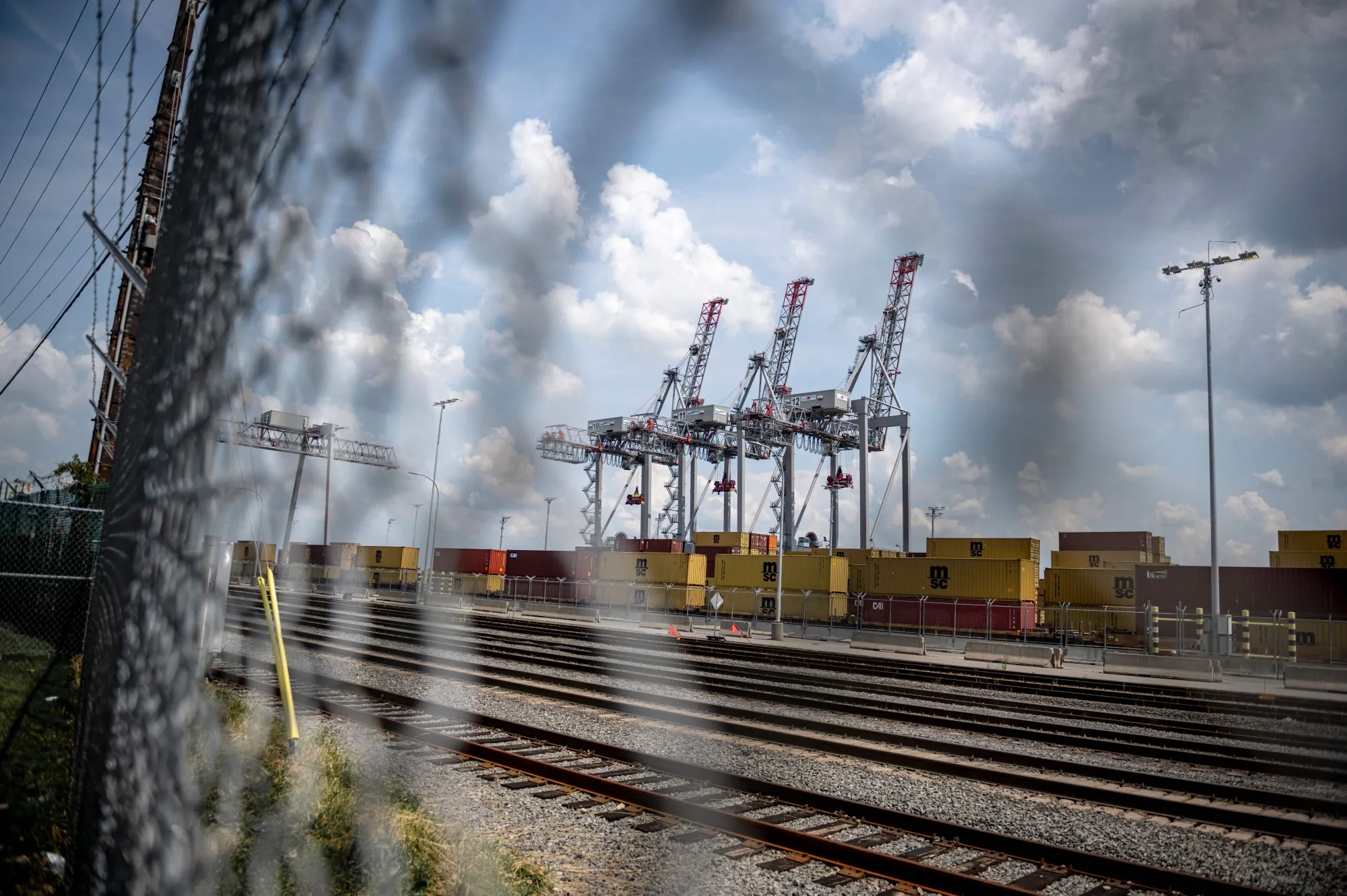 Gantry cranes and shipping containers at the Port of Montreal.