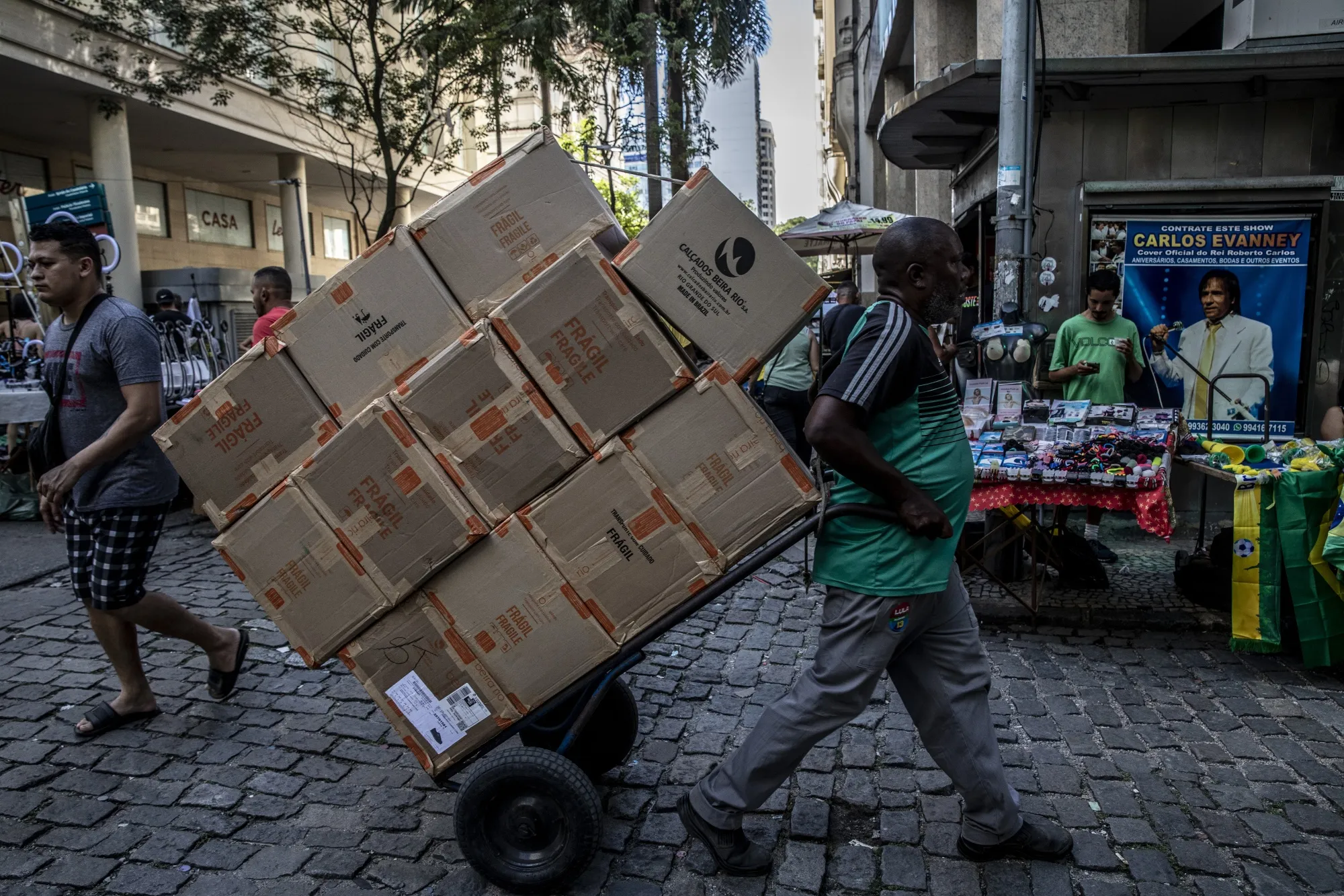 A worker pulls a cart of goods&nbsp;in Rio de Janeiro, Brazil.