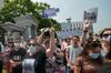 A woman carries a placard reading “Freedom for Furgal!”, during rally in Khabarovsk, Russia, on July 18.