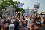 A woman carries a placard reading “Freedom for Furgal!”, during rally in Khabarovsk, Russia, on July 18.