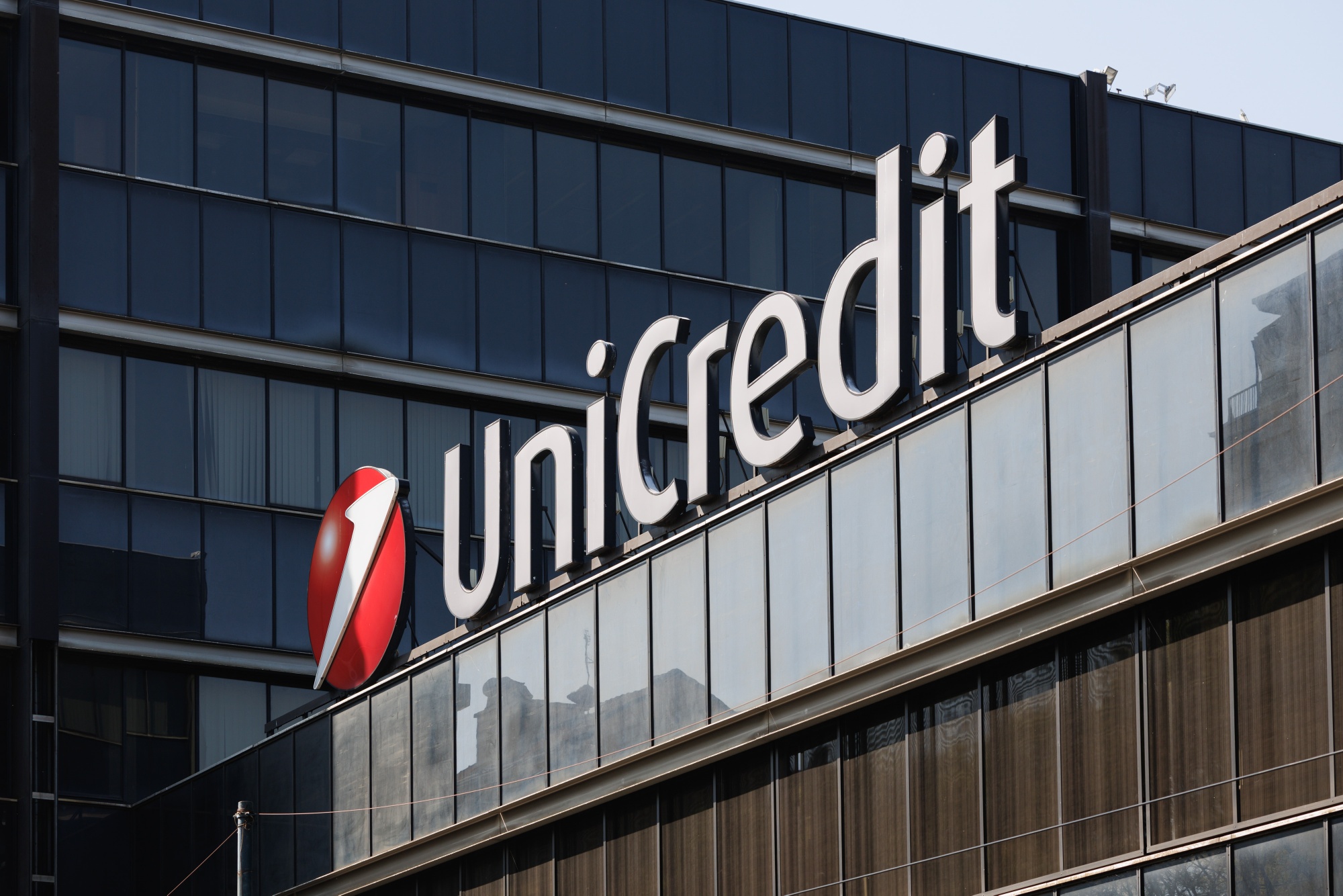 A UniCredit SpA bank logo at a company's bank branch in Turin. Photographer: Giuliano Berti/Bloomberg
