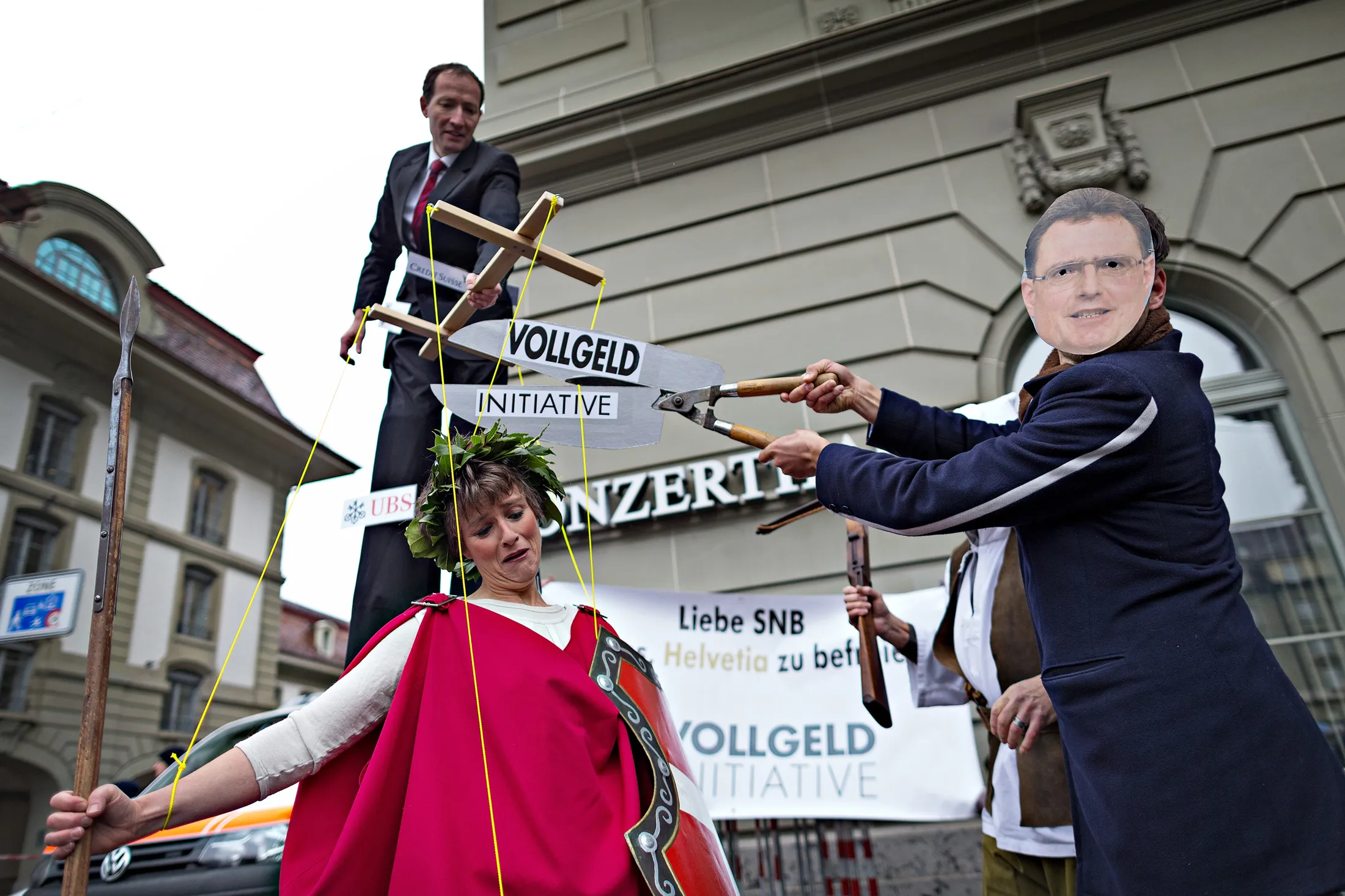 Protestors stage a puppet show on April 28.