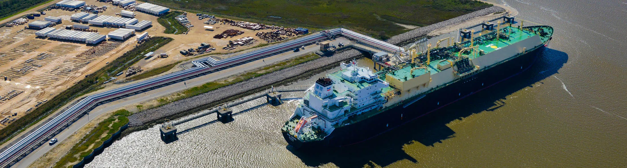 The Asia Vision LNG carrier ship sits docked at the Cheniere Energy Inc. terminal in this aerial photograph taken over Sabine Pass, Texas, U.S., on Wednesday, Feb. 24, 2016. Cheniere said in a statement last month. Cheniere Energy Inc. expects to ship the first cargo of liquefied natural gas on Wednesday to Brazil with another tanker to be loaded a few days later, marking the historic start of U.S. shale exports and sending its shares up the most in more than a month.
