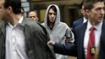 Martin Shkreli, center, exits federal court in New York, on, Dec. 17. Shkreli was arrested on alleged securities fraud related to Retrophin Inc., a biotech firm he founded in 2011.
