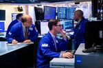Traders work on the floor of the New York Stock Exchange (NYSE) in New York, US, on Tuesday, May 31, 2022. The S&P 500 defied bear market status just over a week ago and is set to finish May roughly where it started.