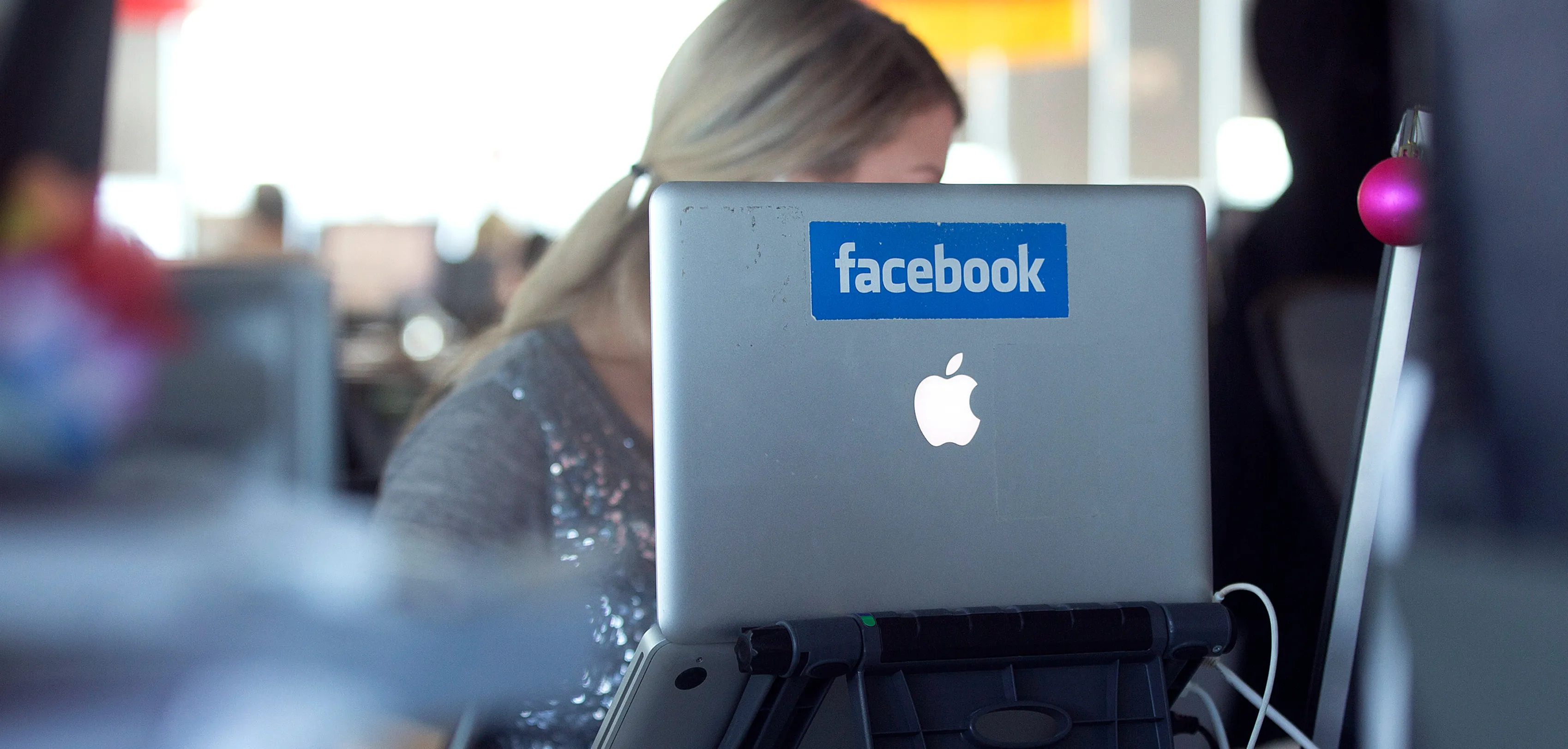 A laptop computer with the Facebook logo is seen on display at the offices of Facebook Inc.'s European headquarters at Hanover Quay in Dublin, Ireland, on Thursday, March 14, 2013. Irelandâs renewed competiveness makes it a beacon for the U.S. companies such as EBay, Google Inc. and Facebook Inc., which have expanded their operations in the country over the past two years.
