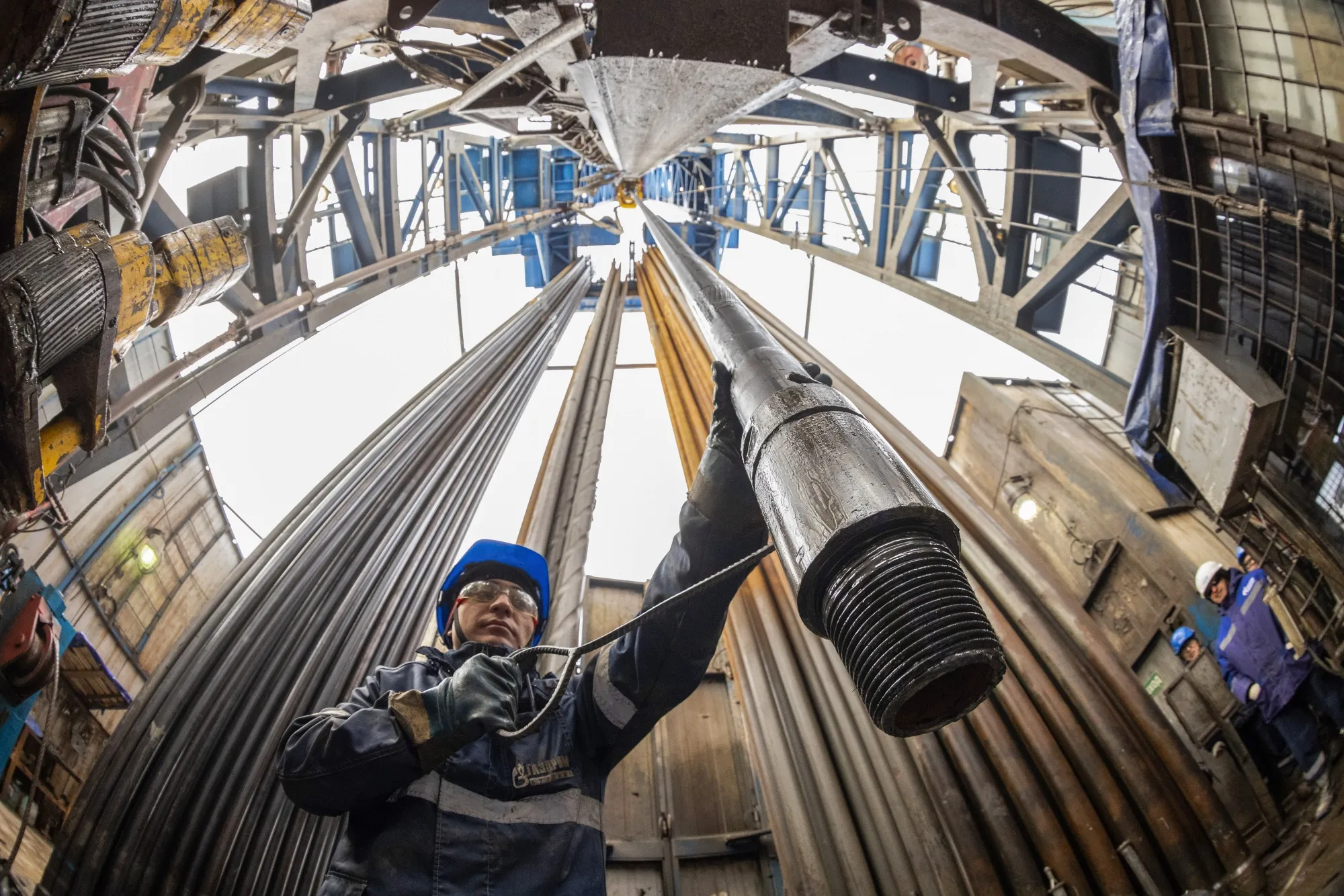 A worker guides a drilling pipe at&nbsp;the Gazprom Chayandinskoye oil, gas and condensate field&nbsp;near Lensk, Russia, on Oct. 13.