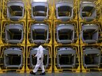 Racks of steel trunk doors await assembly at the Volkswagen AG factory in Emden, Germany.