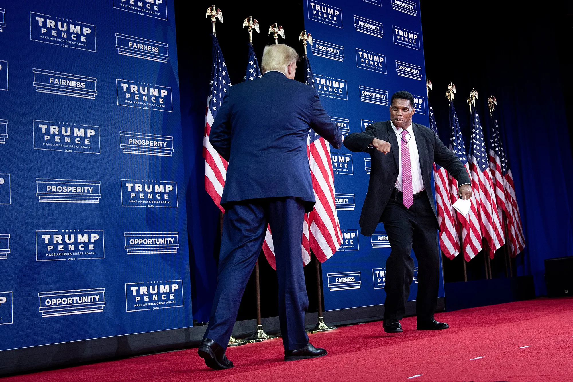 Donald Trump is greeted by Herschel Walker during an event&nbsp;in Atlanta on Sept.&nbsp;25, 2020.