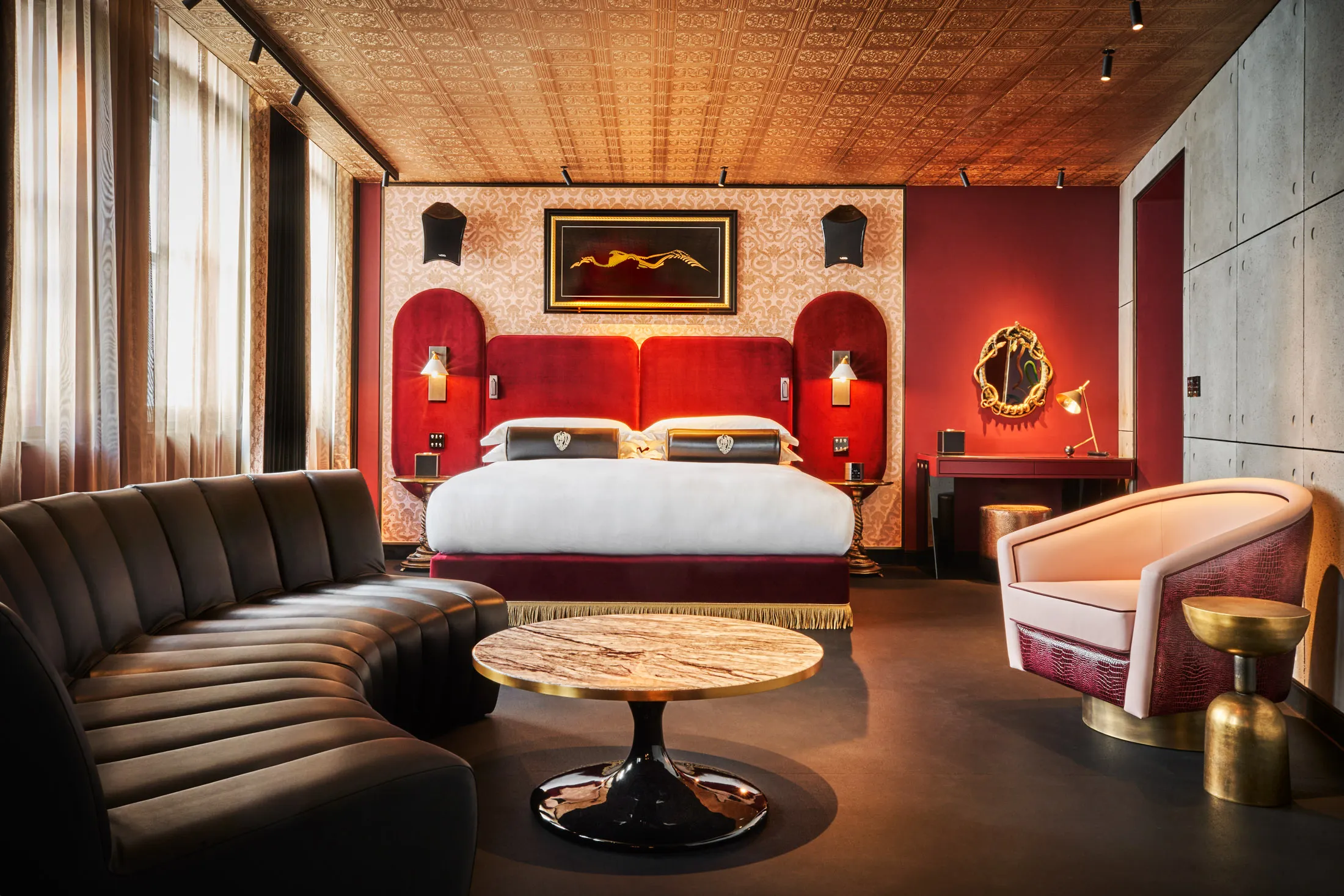 Red velvet headboards, gold mirrors with snake designs, and Void sound systems add to the party theme.