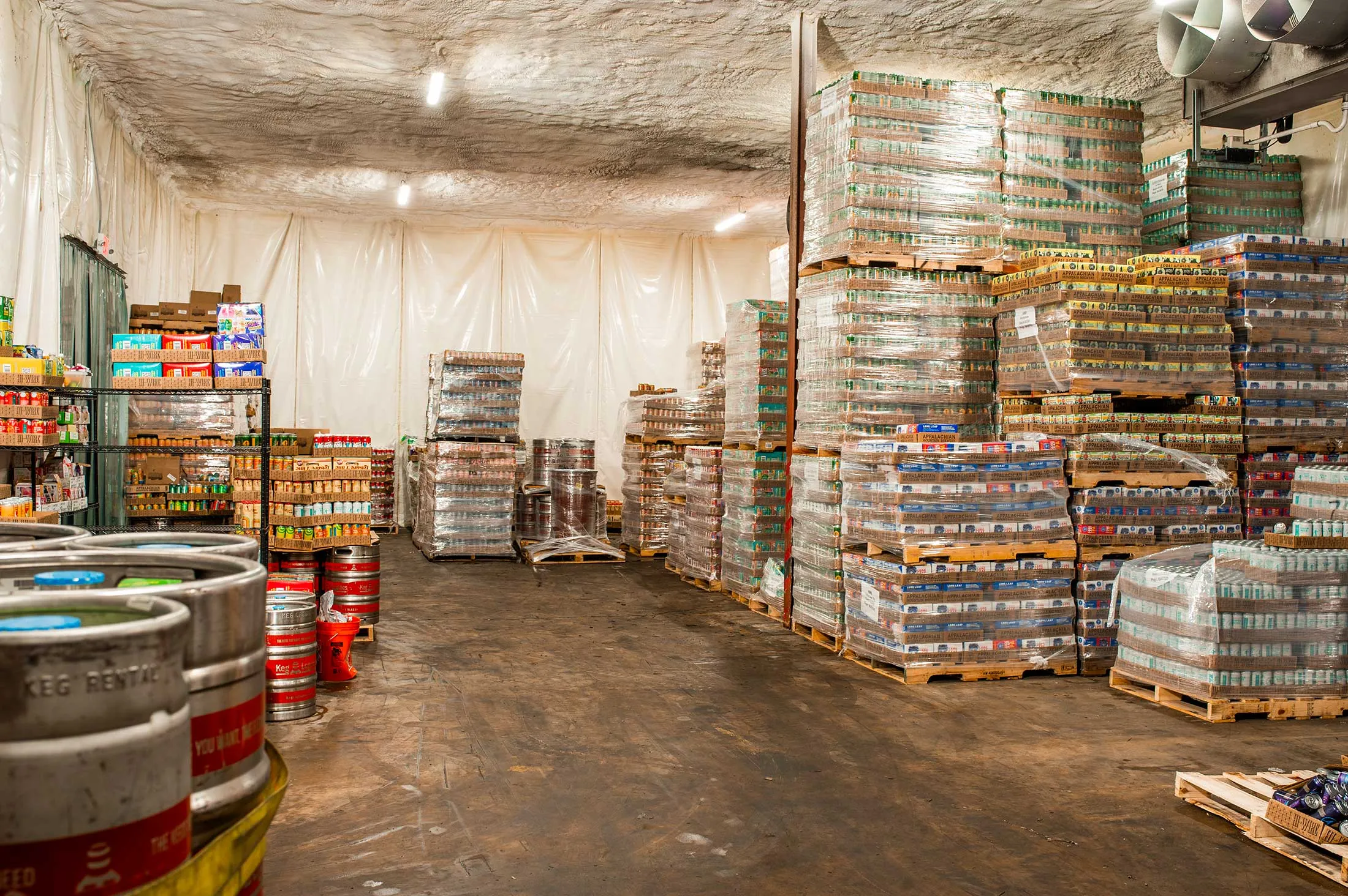 During Helene, floodwaters swept up more than a million cans in Hi-Wire’s warehouse and left behind feet of sludge.