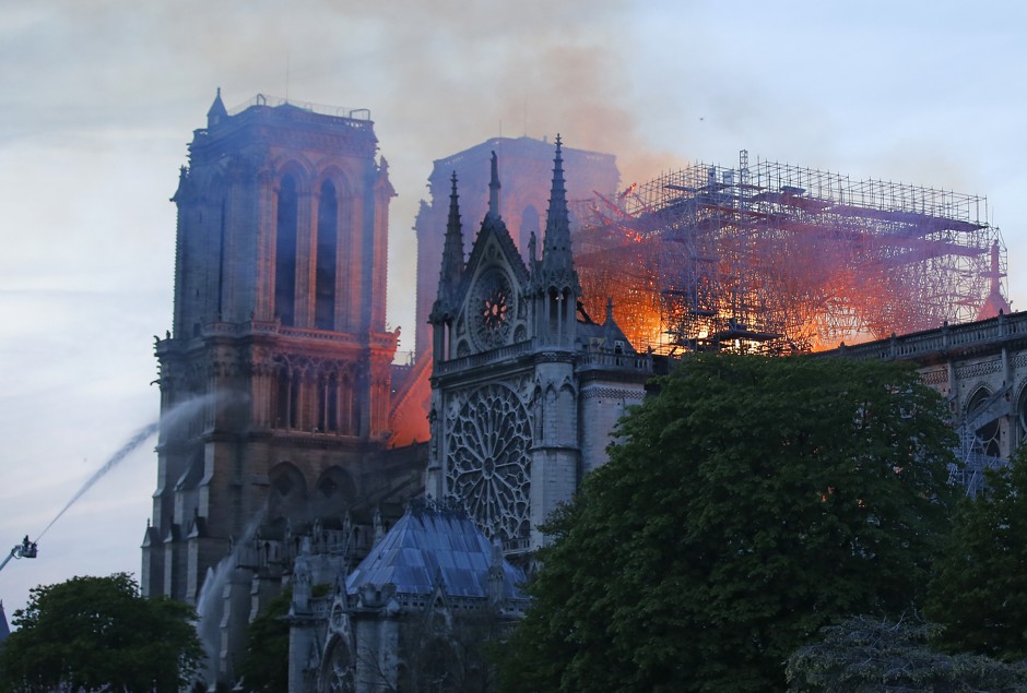 Firefighters work to put out the immense blaze that threatened to consume the Notre-Dame Cathedral.