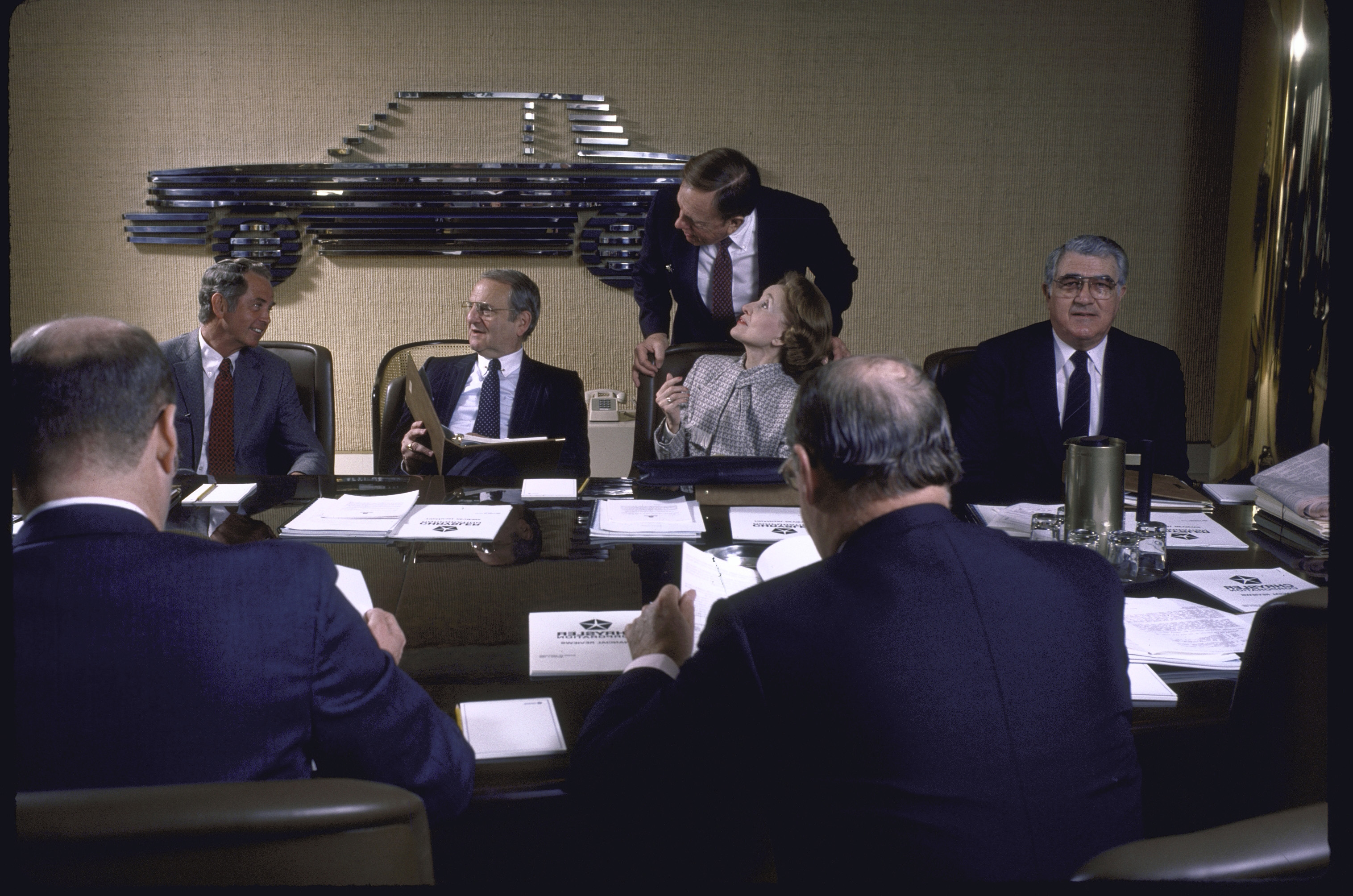 United Auto Workers union chief Owen Bieber, right, at a Chrysler board meeting.
