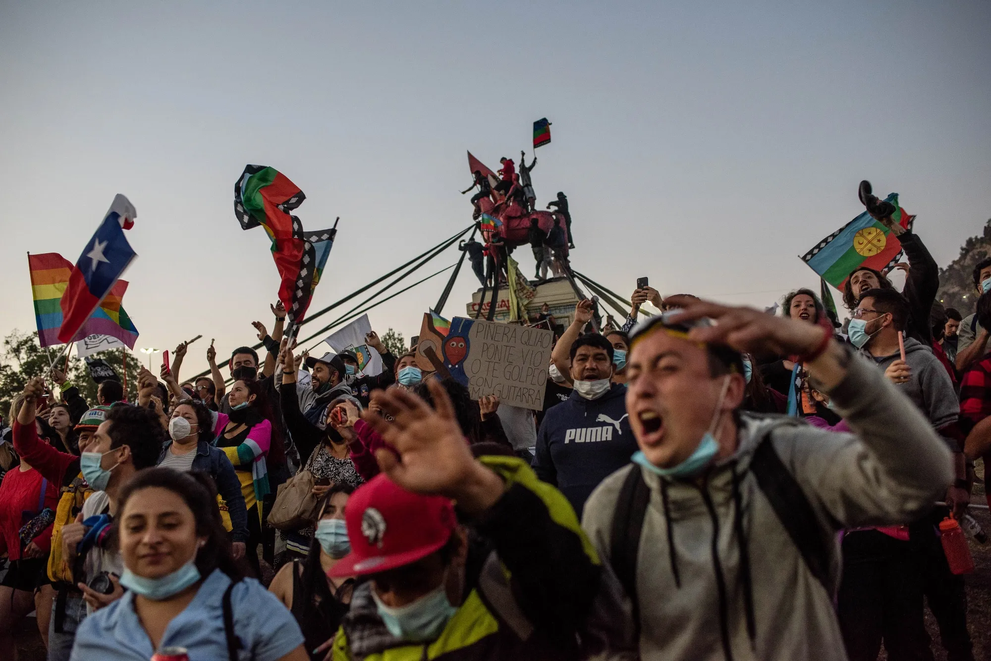 People celebrate at Plaza Italia square after a national referendum vote in Santiago on Oct. 25.