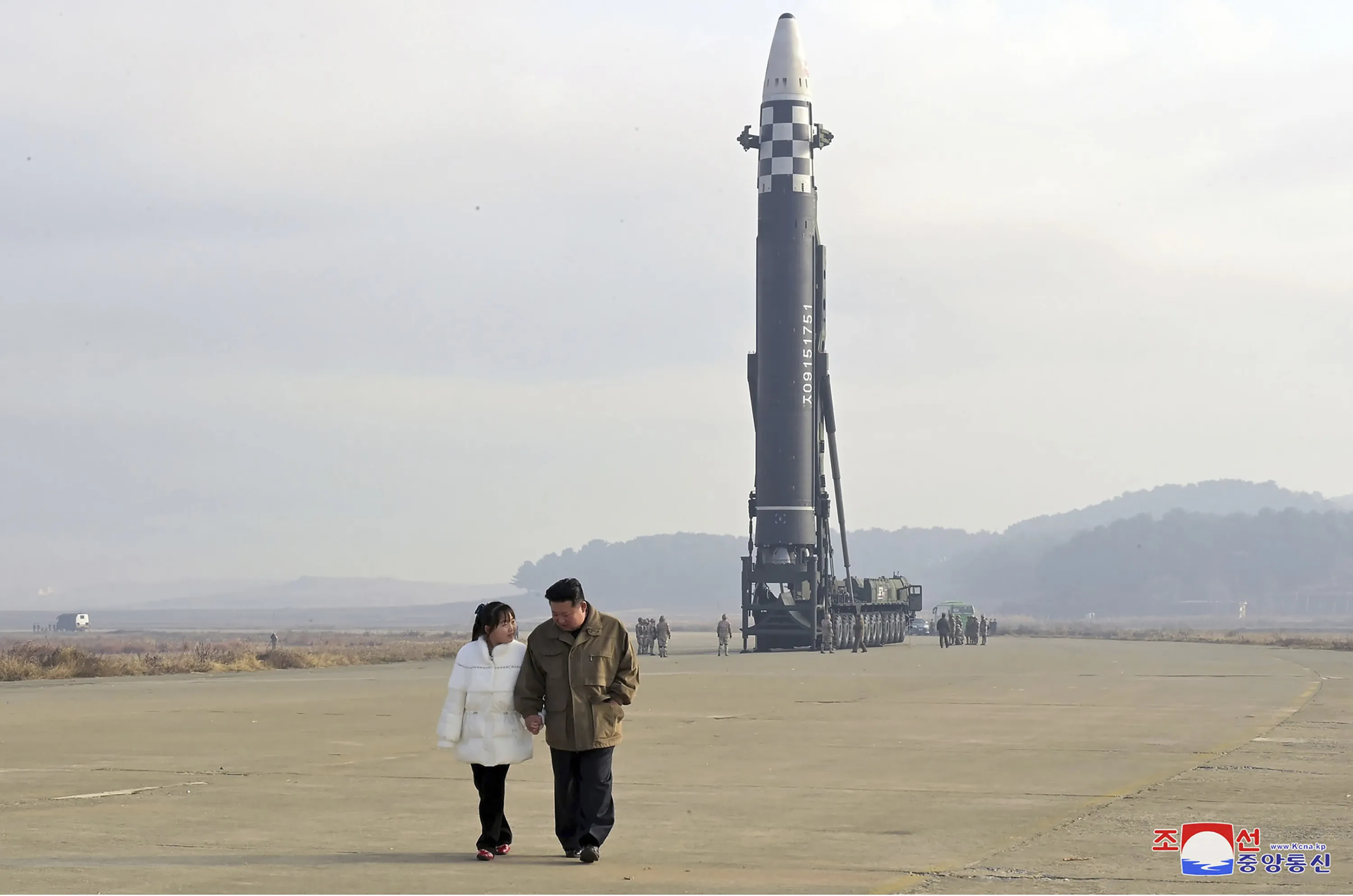 Kim Jong Un and his daughter inspect the site of a missile launch at Pyongyang International Airport.