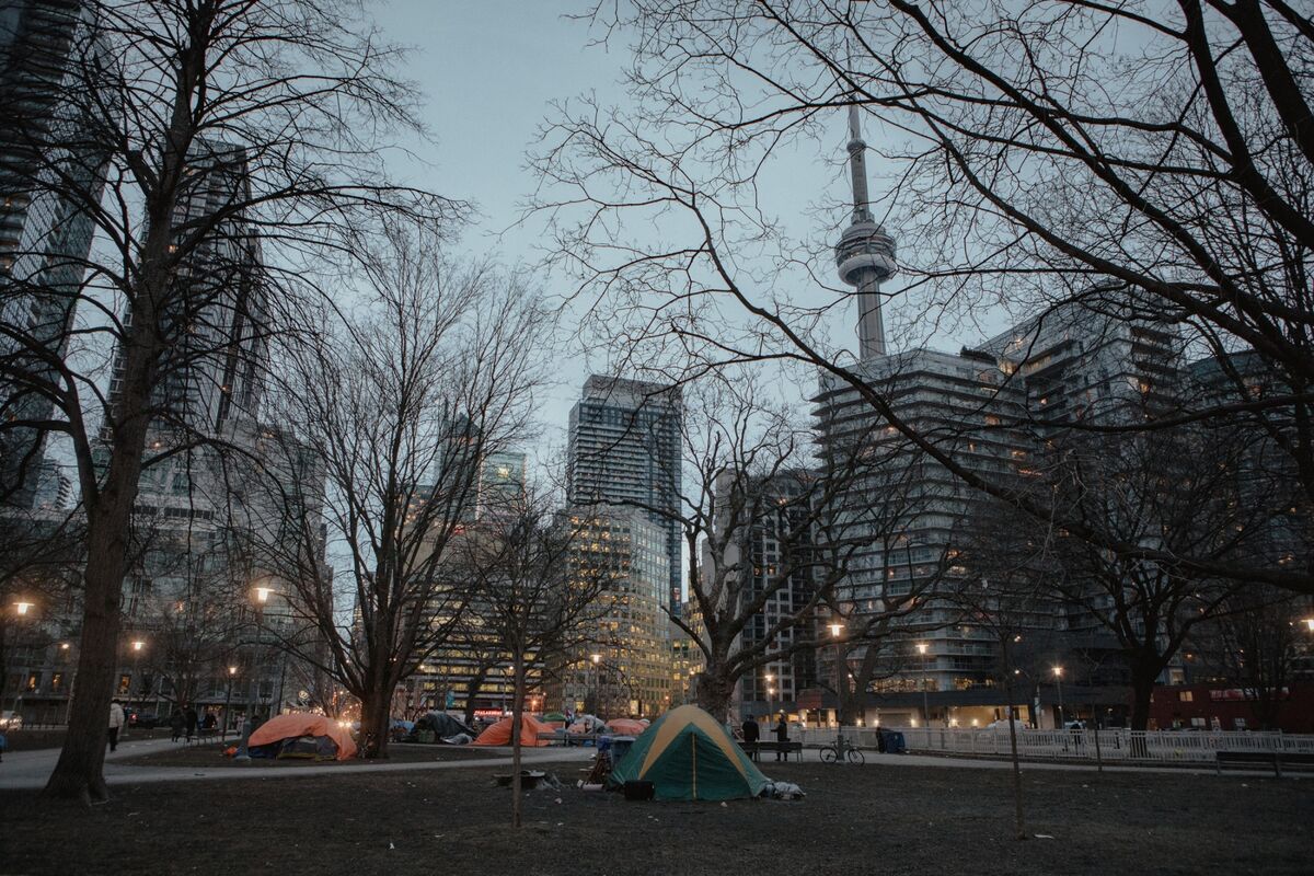 Tents, offering temporary shelter to the unhoused, on the grounds of Clarence Square Parkette in Toronto. 