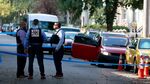 Detectives look over the crime scene on North Henry Street where a crew member on “Law & Order: Organized Crime” was shot on July 19.