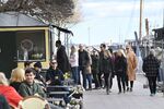 People line up to buy ice cream at Norr Mälarstrand street in Stockholm, Sweden, on April 19, 2020, amid the new coronavirus COVID-19 pandemic. (Photo by Fredrik SANDBERG / TT News Agency / AFP) / Sweden OUT (Photo by FREDRIK SANDBERG/TT News Agency/AFP via Getty Images)