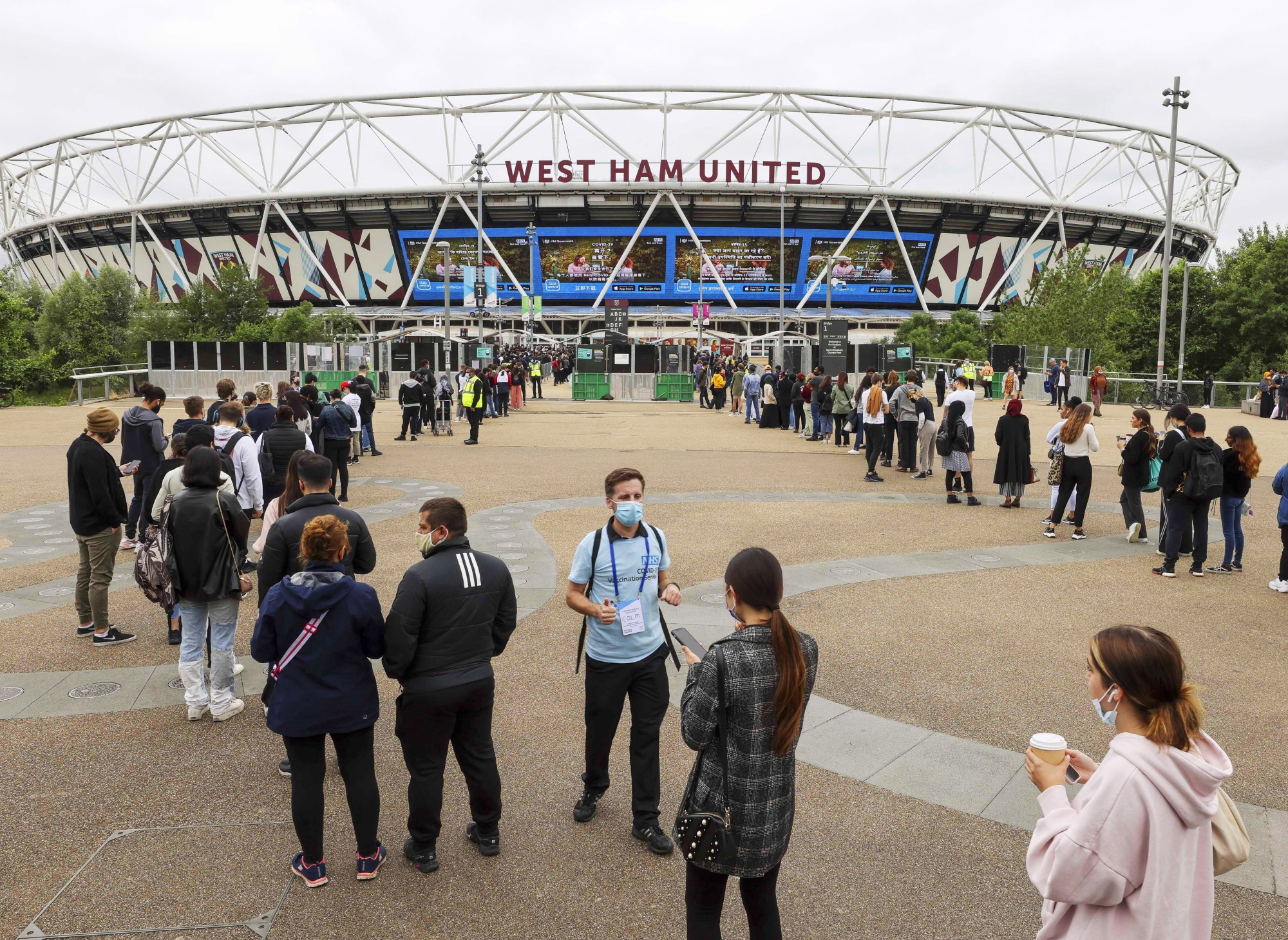 People queue&nbsp;to be inoculated at a mass vaccination event at the London Stadium in London, on&nbsp;June 19.