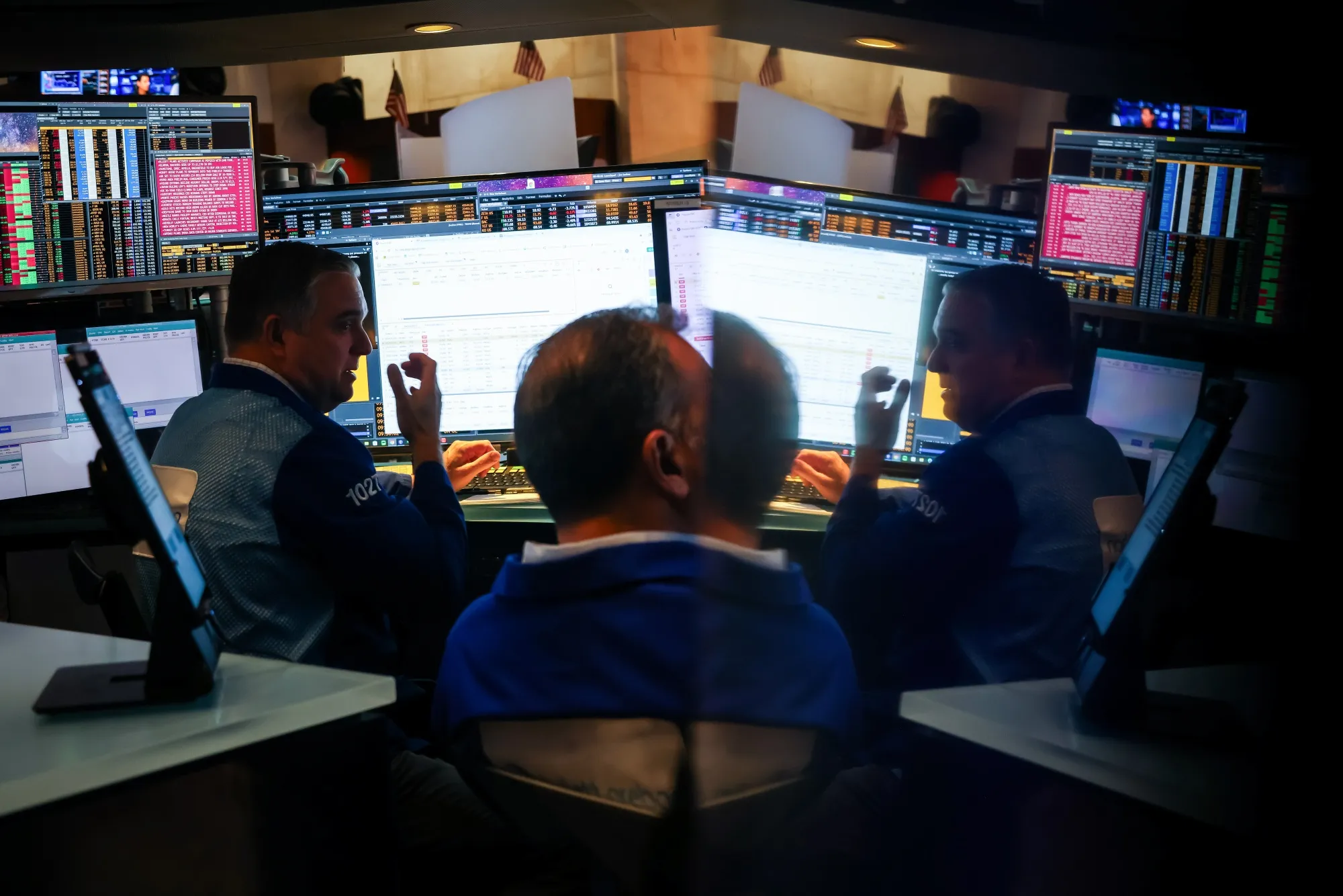 Traders work on the floor at the New York Stock Exchange (NYSE) in New York.