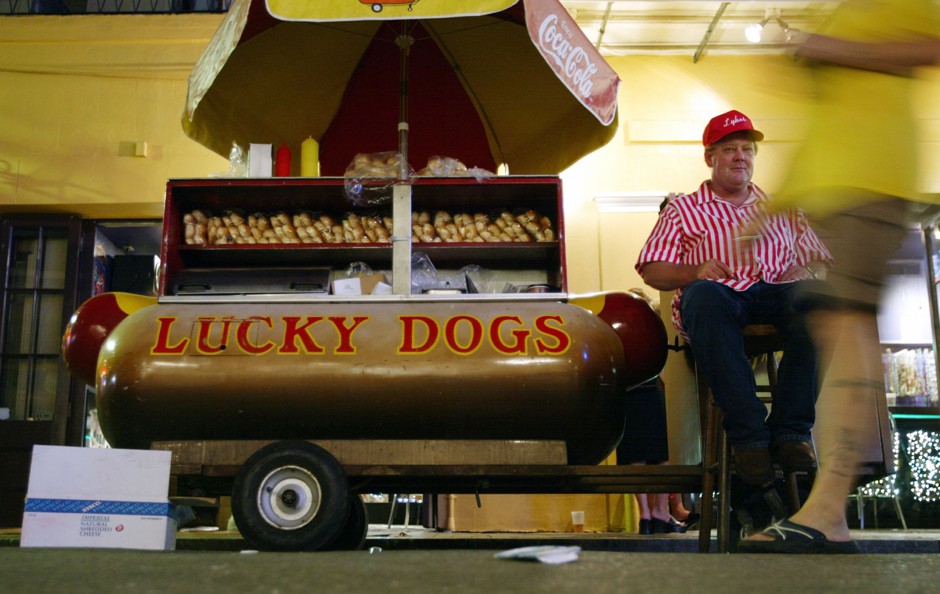 A street vendor in New Orleans with a load of Lucky Dogs.
