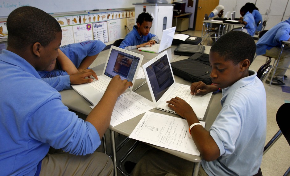 Students work on their laptops in Dorchester, Massachusetts.