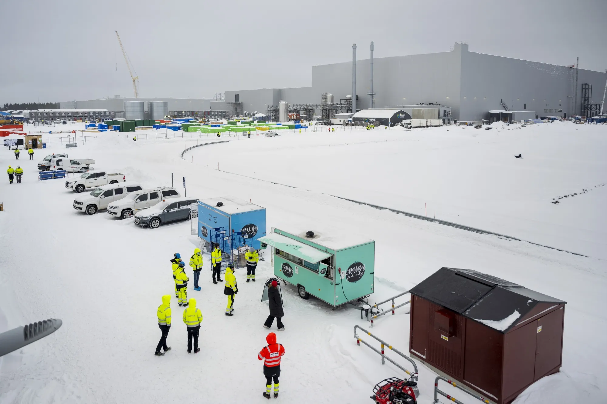 Workers gather at a food truck in the snow at the Northvolt Ett&nbsp; plant in Skelleftea, Sweden, in February 2022. Volkswagen is an investor in Northvolt.