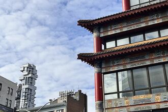56 Leonard Street, known as the Jenga Building, Designed by Herzog & de Meuron seen from Canal street in Chinatown, Manhattan