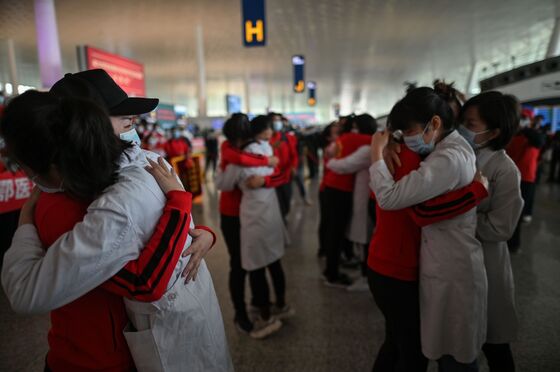 Chaos And Joy At Wuhan Airport As Doctors Take First Flights Out
