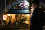 Customers dine inside an Izakaya restaurant in the Shimbashi District of Tokyo.