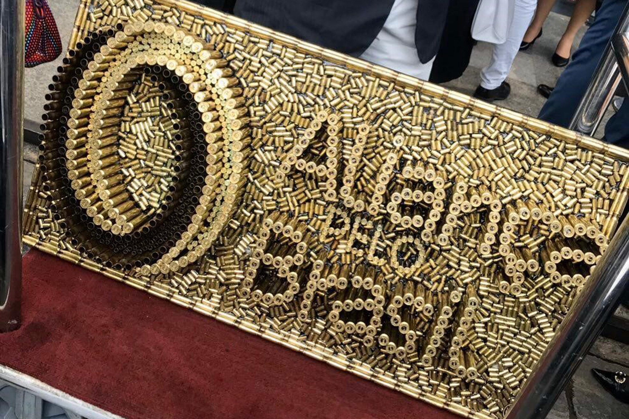 A sculpture that bears the “Alliance” party symbol built out of bullet casings. 