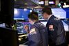 Traders work on the floor of the New York Stock Exchange (NYSE) in New York, U.S.