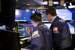 Traders work on the floor of the New York Stock Exchange (NYSE) in New York, U.S.