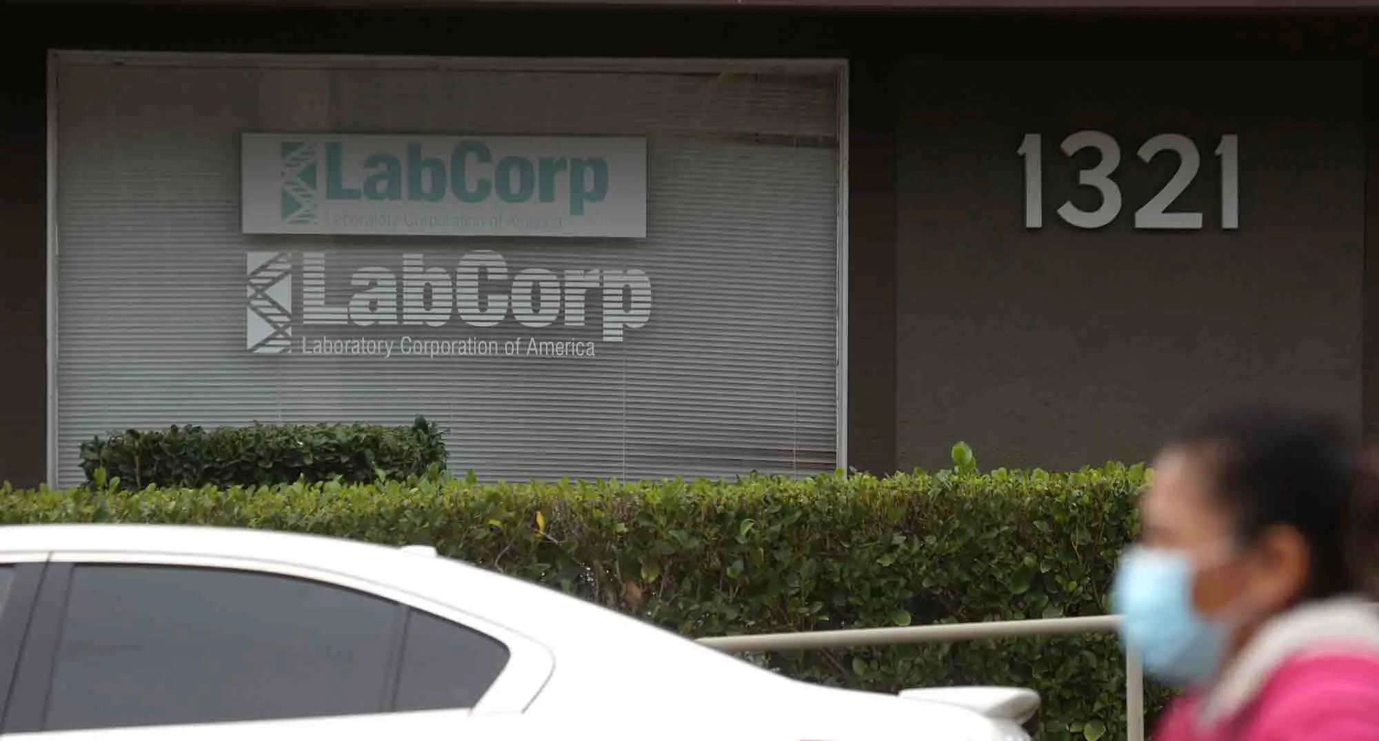 A pedestrian walks by a LabCorp office in Greenbrae, California, on Feb.&nbsp;11, 2021.