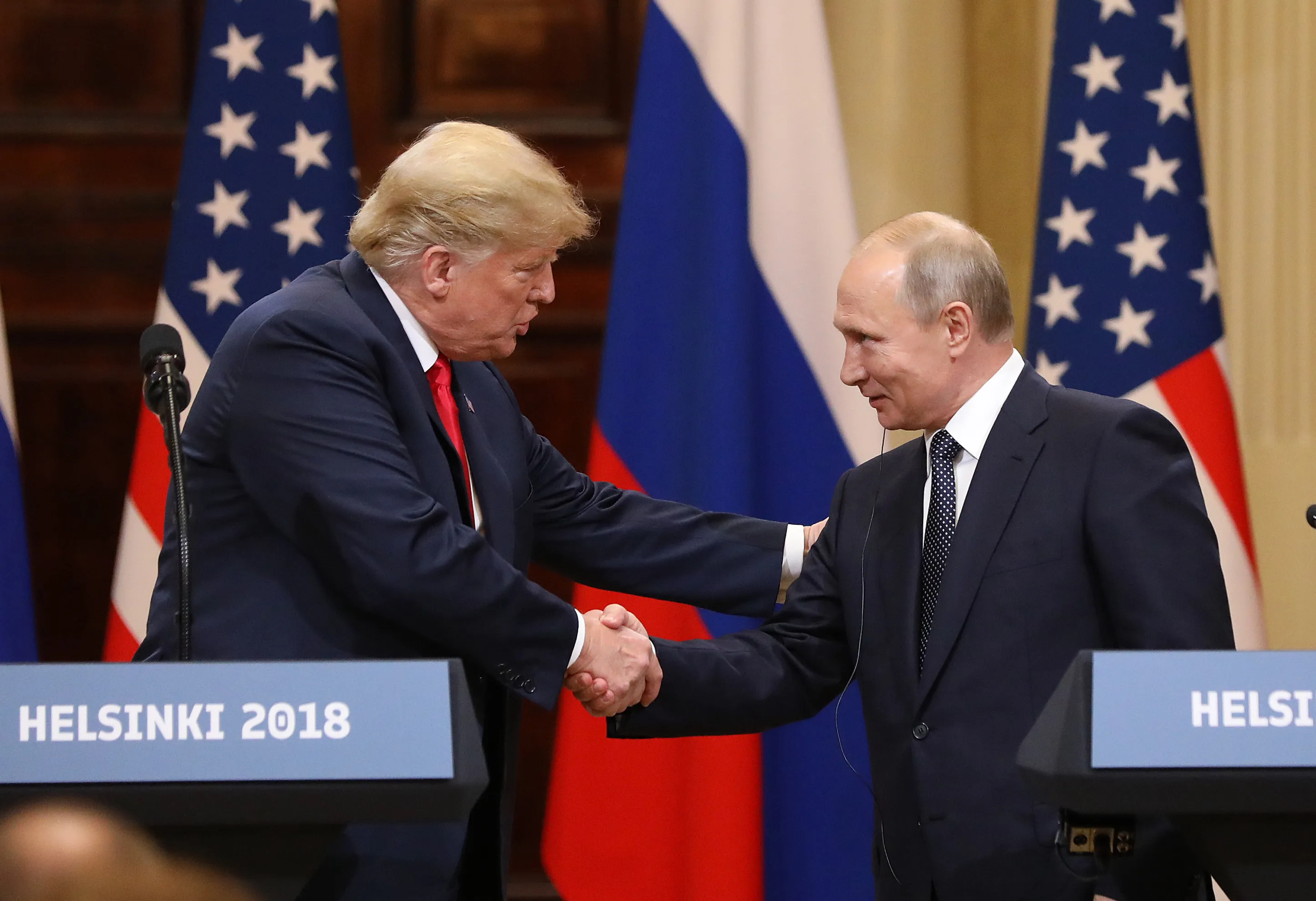 Donald Trump and&nbsp;Vladimir Putin in 2018.&nbsp;The book reports that Trump, while president in 2020, secretly sent Putin Abbott Covid testing machines when the devices were scarce.