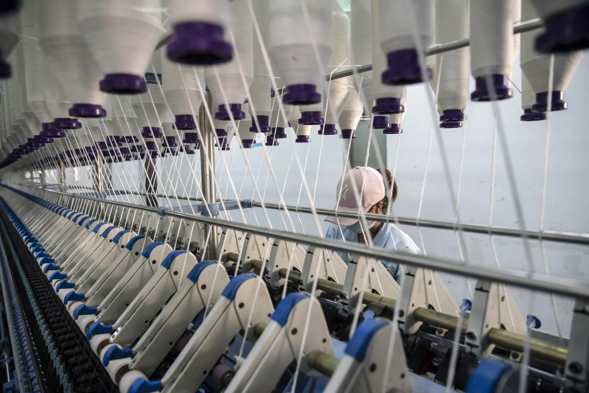 Inside a Textile Factory As China's Factories Roll on, Upending New Year’s Spending Patterns