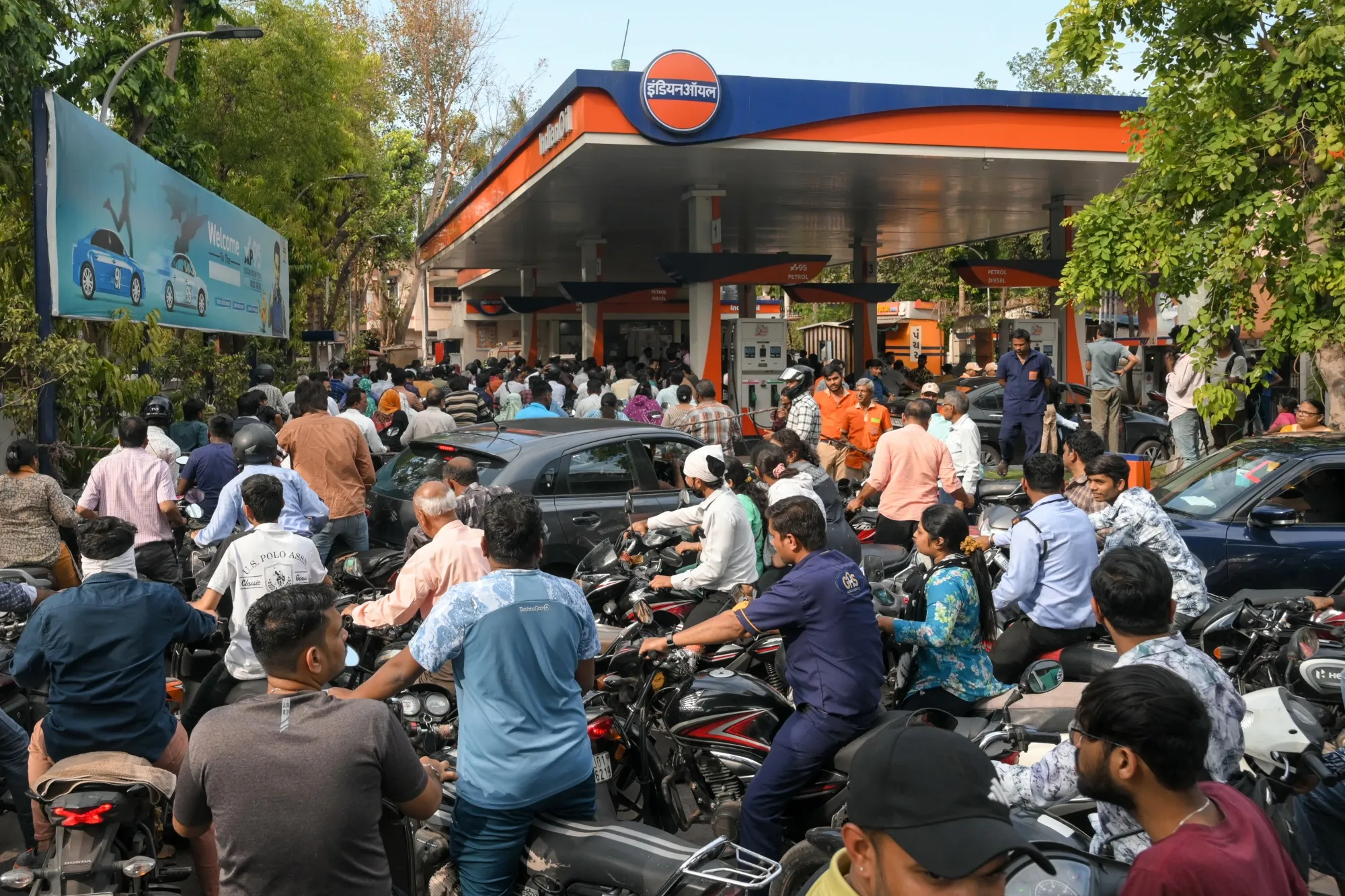 Motorists queue to refuel at a fuel station in Ahmedabad, India on March 23.