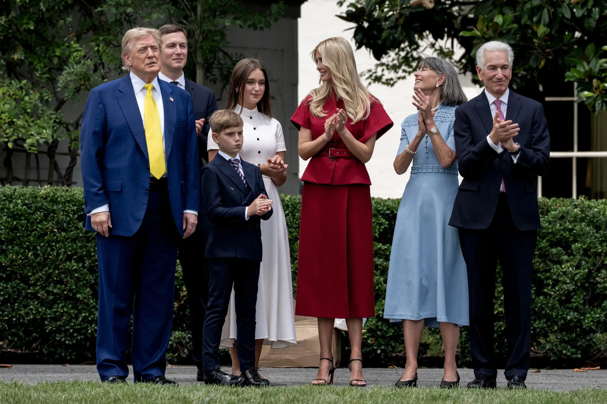 US President Donald Trump with Charles Kushner, right, US ambassador to France, on the South Lawn of the White House on June 18.