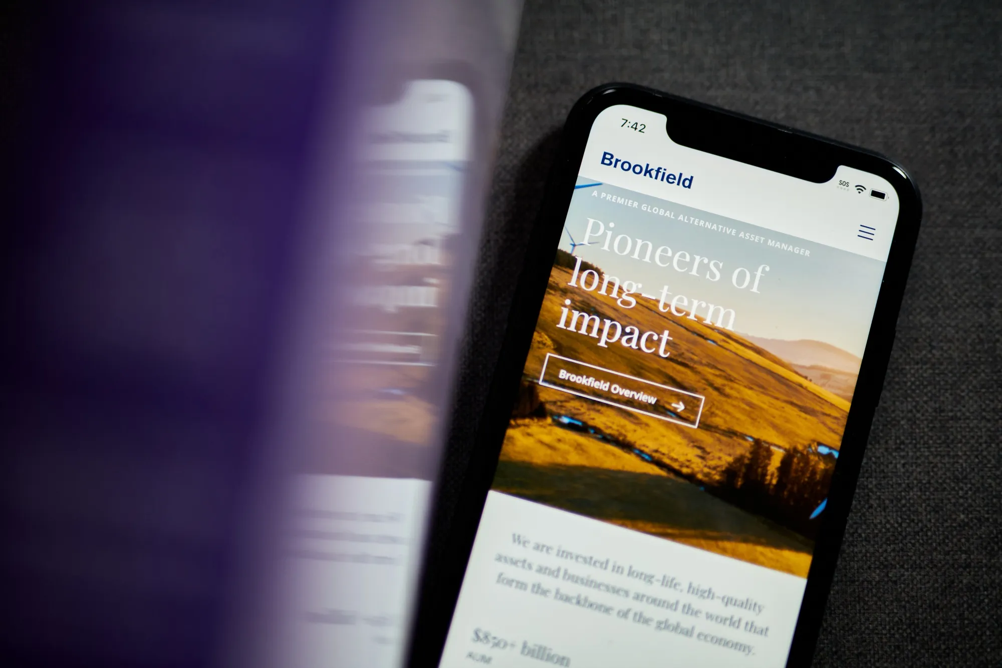 The Brookfield Asset Management website on a smartphone.