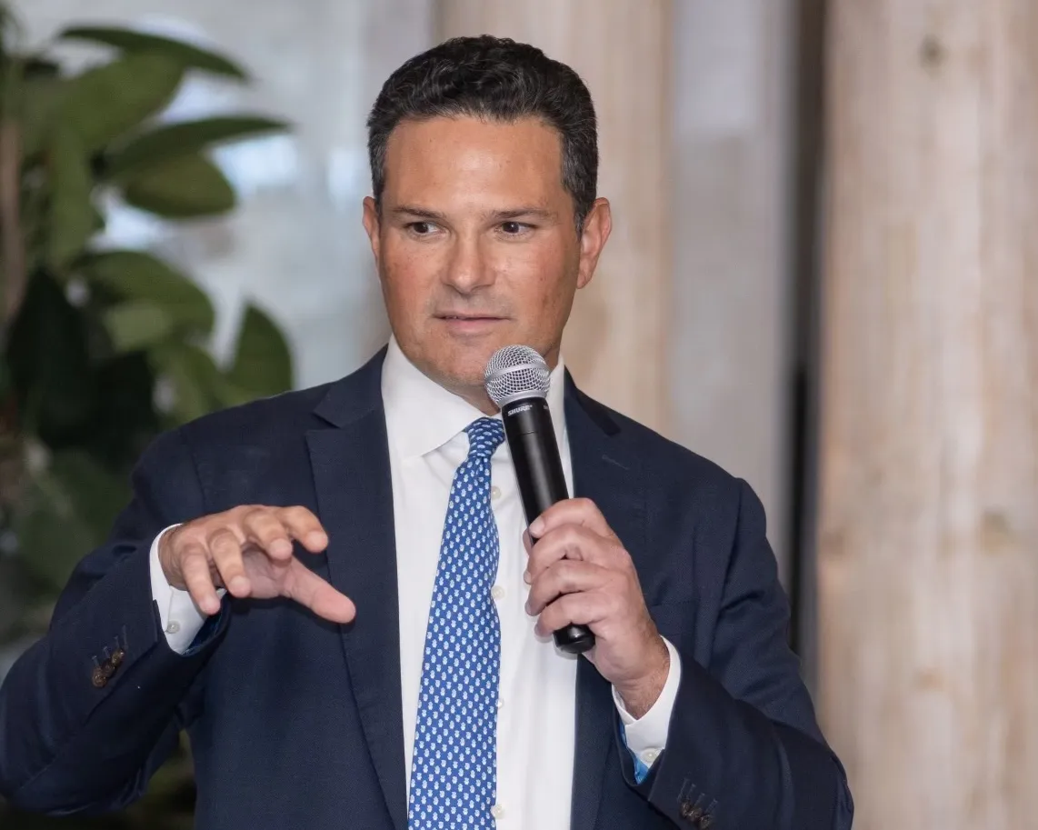 Jon Henes speaks at the one-year anniversary dinner of C Street Advisory Group in New York.