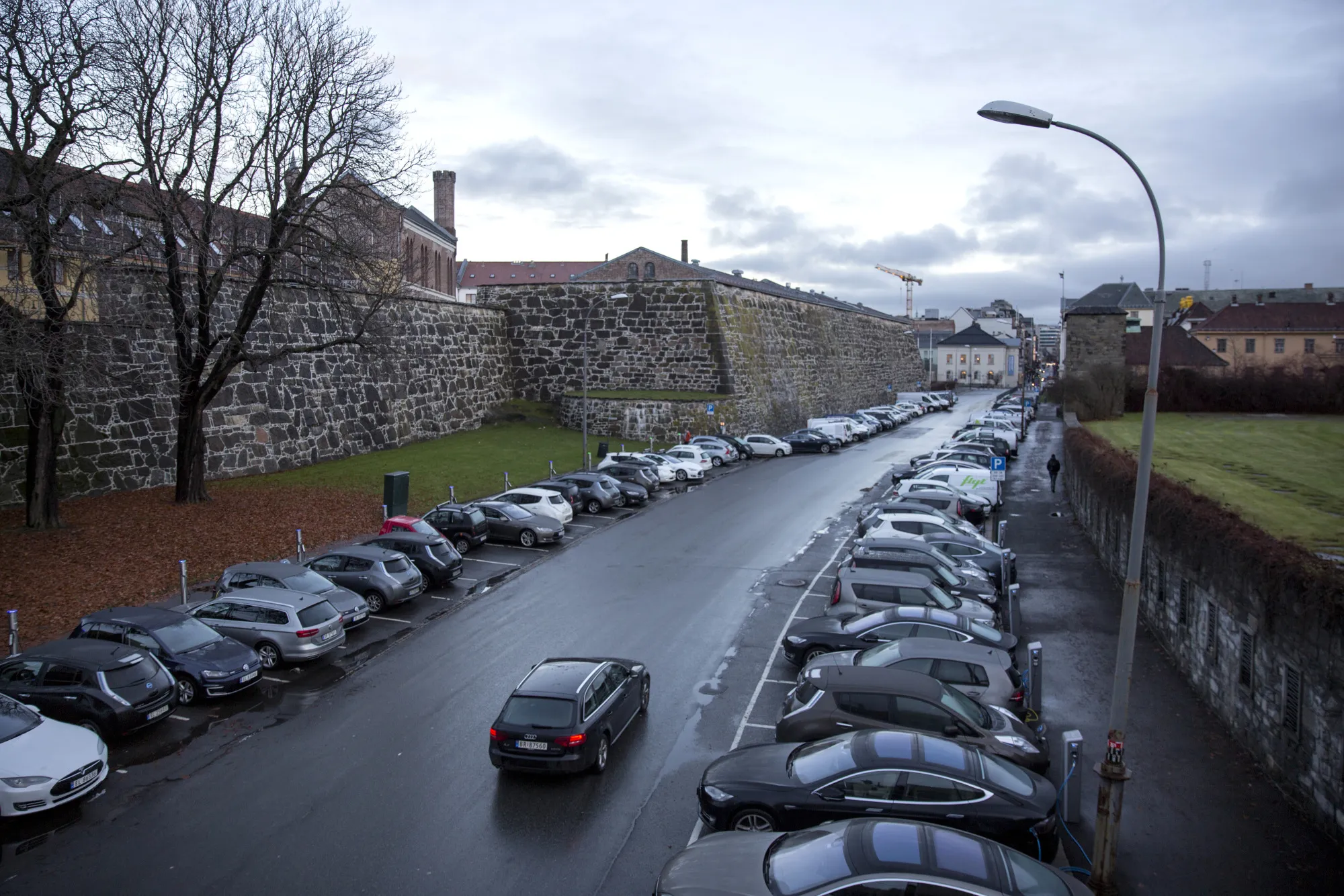 Electric vehicles sit at charging stations in Oslo, Norway.&nbsp;