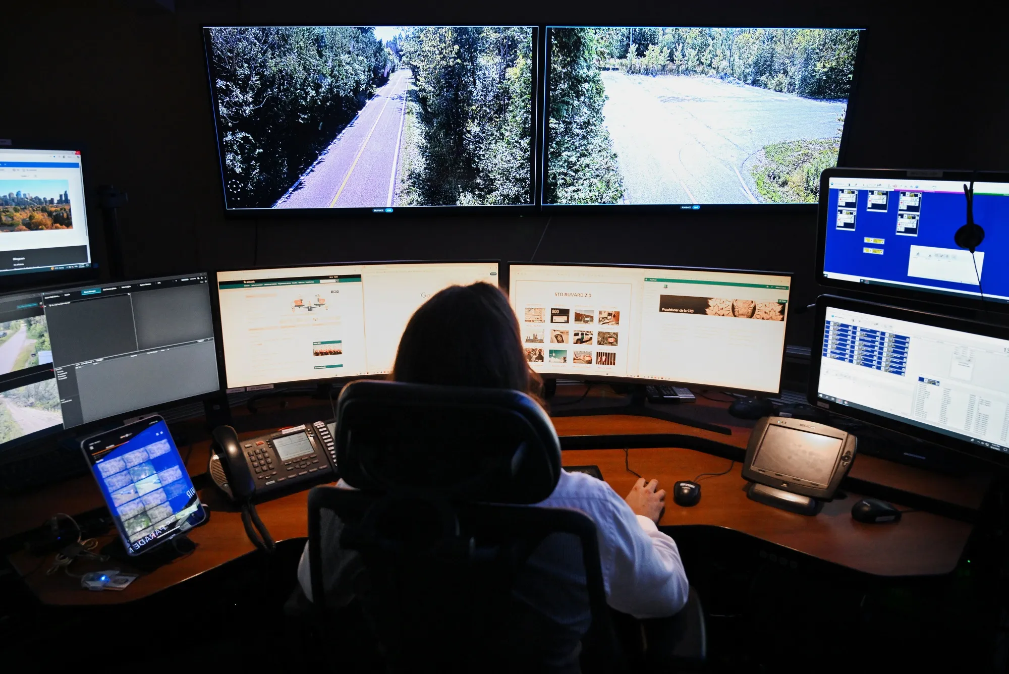 A worker surveys the Roxham Road area at the Canada-US border in the control room at the Royal Canadian Mounted Police headquarters in Montreal.