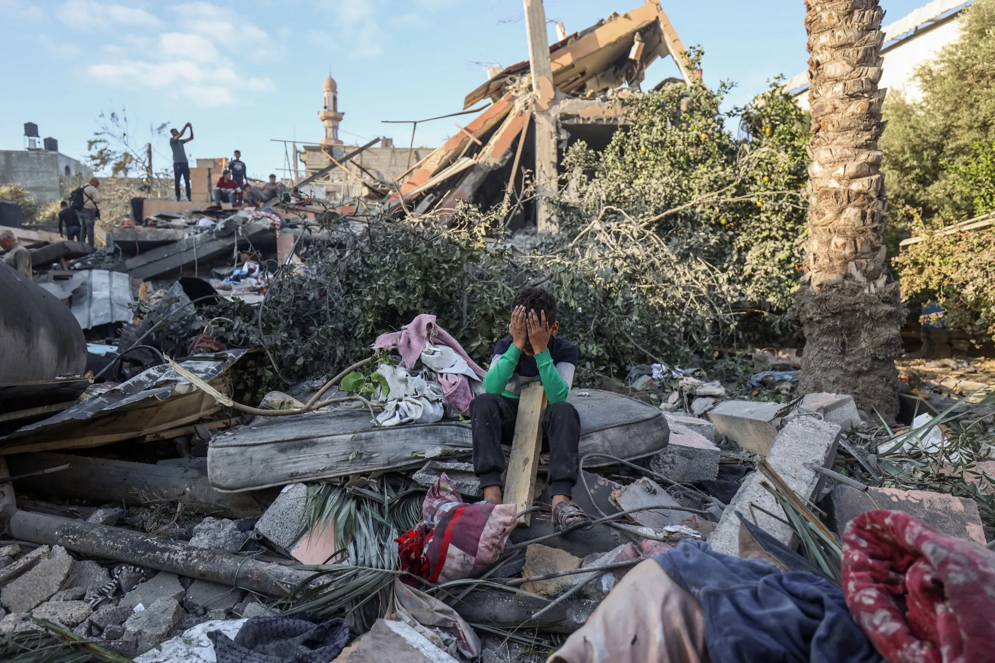 A boy sits amid the rubble of a house destroyed in an Israeli strike in Nuseirat, in the Gaza Strip, on Oct. 29.
