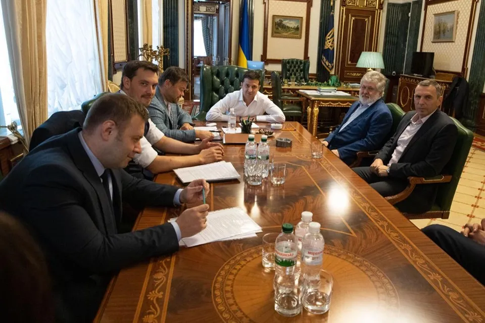 Volodymyr Zelenskiy, center and Igor Kolomoisky, second right, attend a meeting in the Presidential office on Sept. 10, in Kyiv.