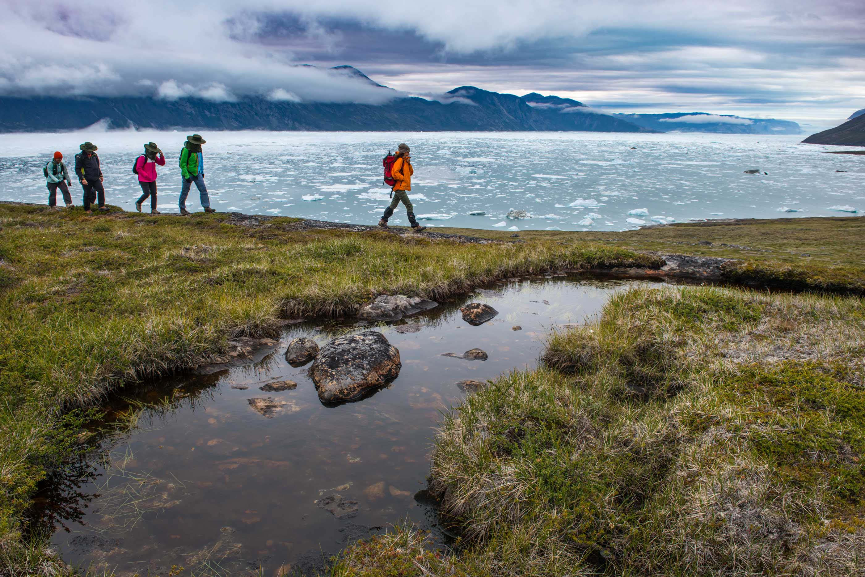 Hikers on flat terrain in the vicinity of Camp Kiattua.