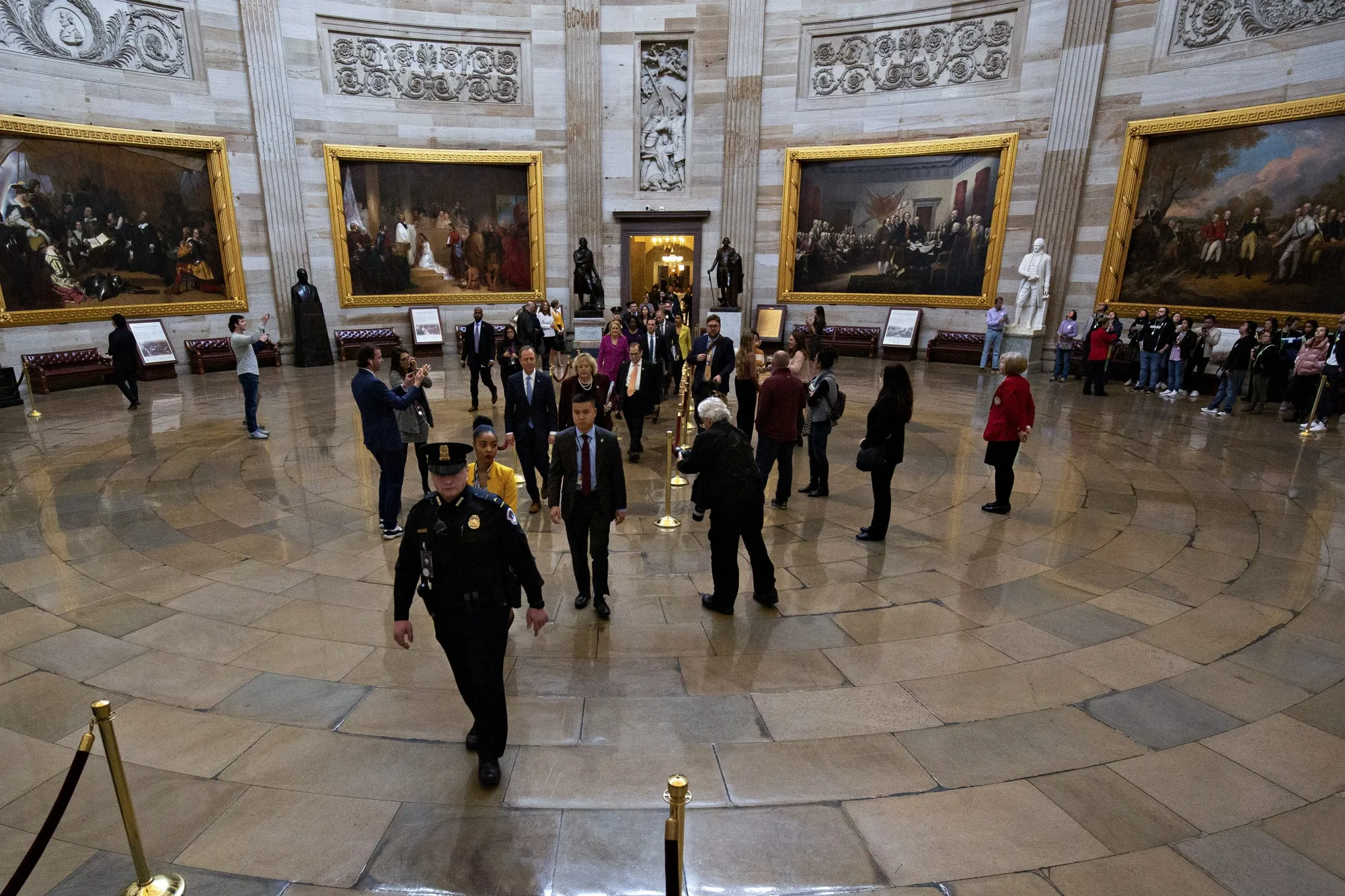 House impeachment managers Representative Adam Schiff, a Democrat from California, and Representative Zoe Lofgren, a Democrat from California, center, walk to the Senate floor at the U.S. Capitol in Washington, D.C. on Jan. 24, 2020.