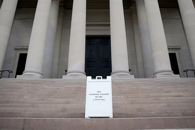 A sign alerting visitors that the National Gallery of Art is closed stands outside the building as it remains indefinitely closed on Oct. 1 in Washington